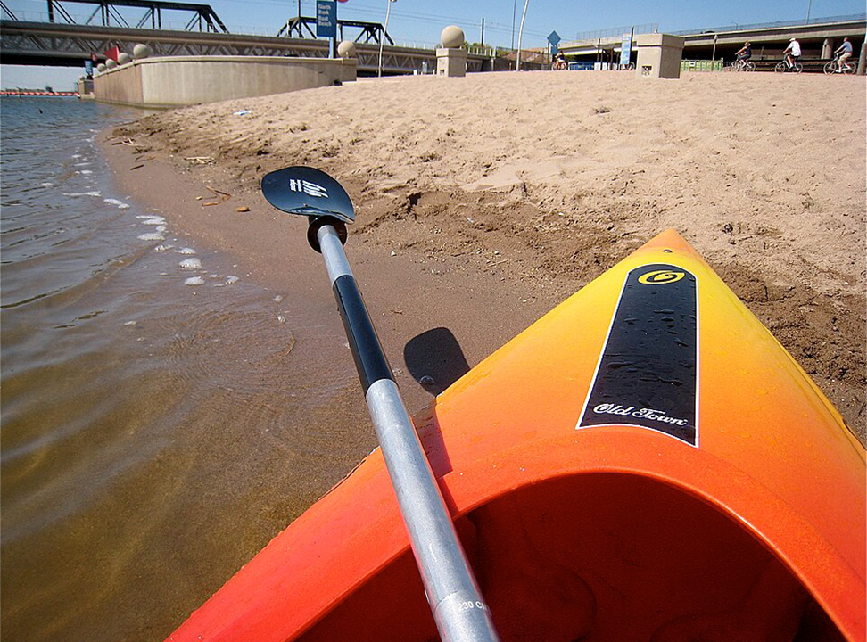 Kayak pulled up to the Tempe Town Lake beach